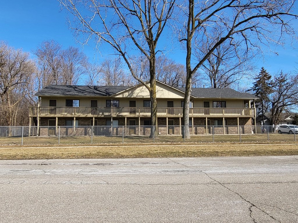 an apartment building on the side of a road