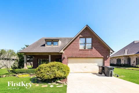 a house with a driveway and a garage door