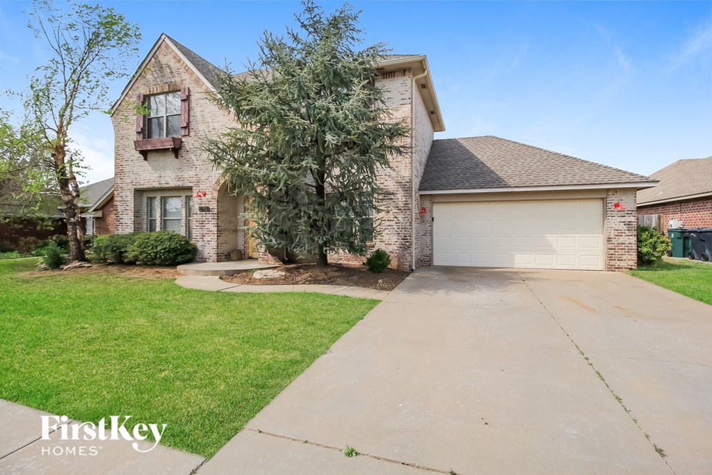 A house with a driveway in front of it.