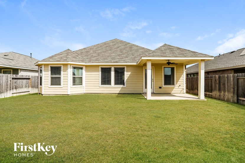 A house with a lawn in front of it.