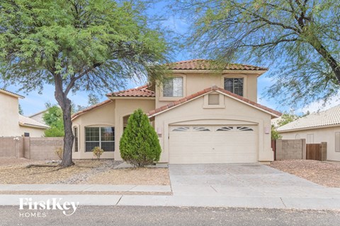 A house with a garage is for sale.