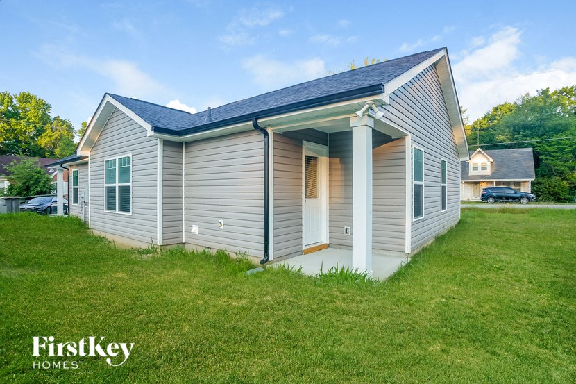 a small house with a solar roof on top of it