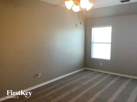a empty room with white walls and a window