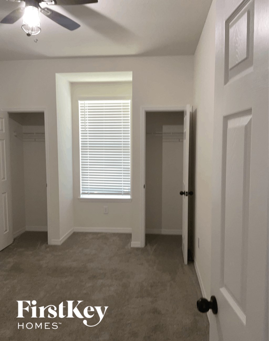 a room with a closet and a window and a door