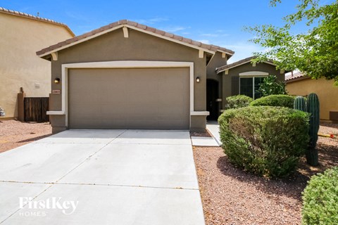 a home with a driveway and a garage door