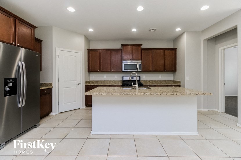 a kitchen with a counter top and a refrigerator