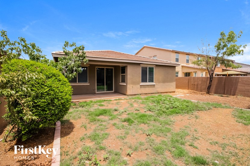 a house with a yard and a fence