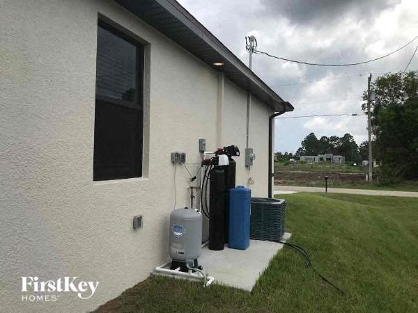 the side of a house with a bunch of gas pumps