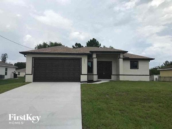 a house with a driveway and a garage door