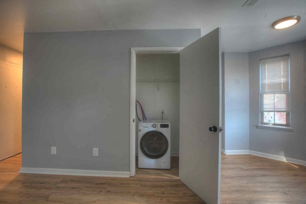 a laundry room with a washer and dryer in it