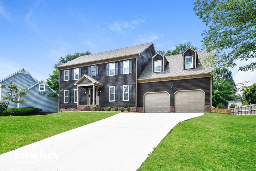 a large house with a garage and a driveway