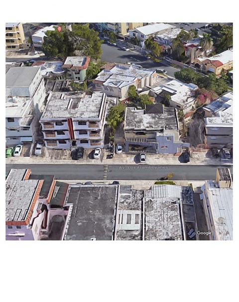 A street view of a city with buildings and cars.