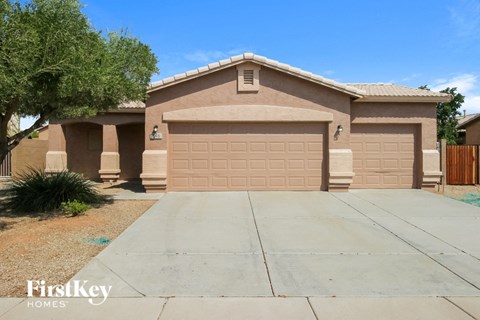 a house with a driveway and a garage door