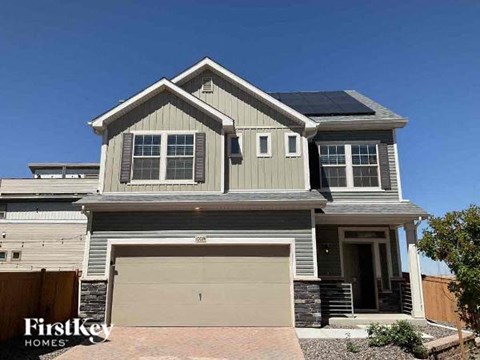 a house with a garage door and a