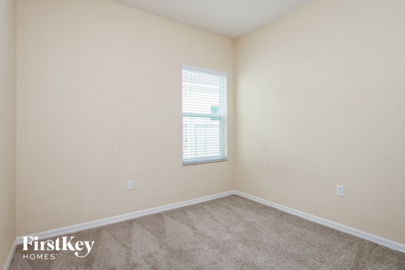 a room with carpet and a window in it
