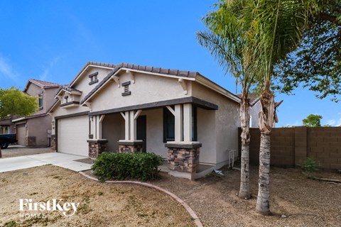 a house with a palm tree in front of it