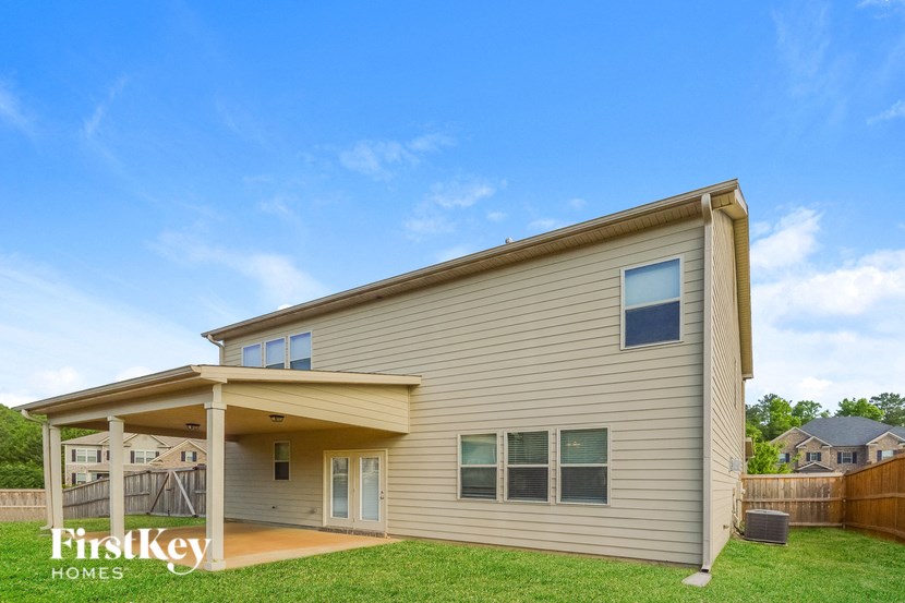 a house with a porch and a lawn