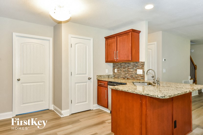a kitchen with a granite counter top and