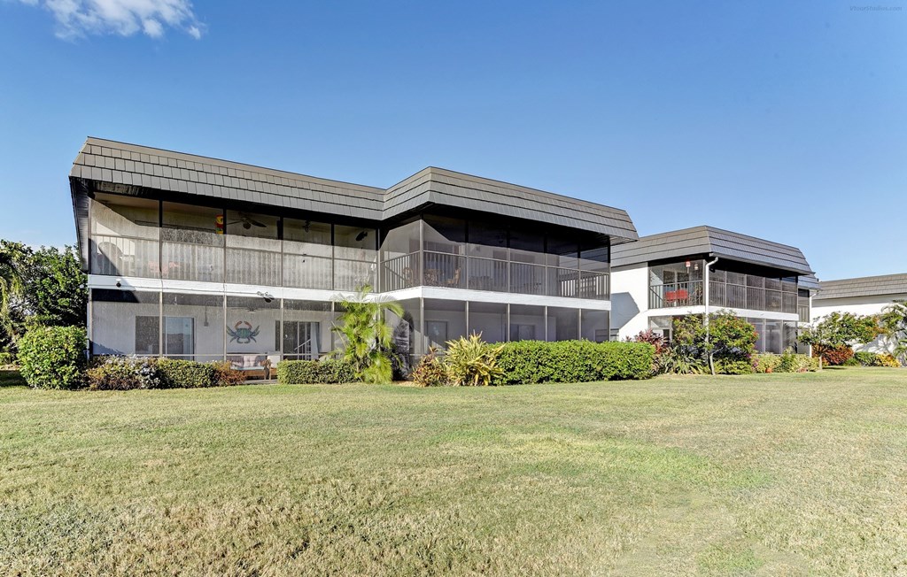 a view of a building with grass in front of it
