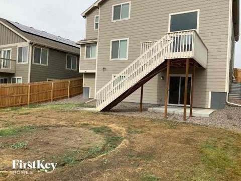 A house with a staircase leading to the entrance.