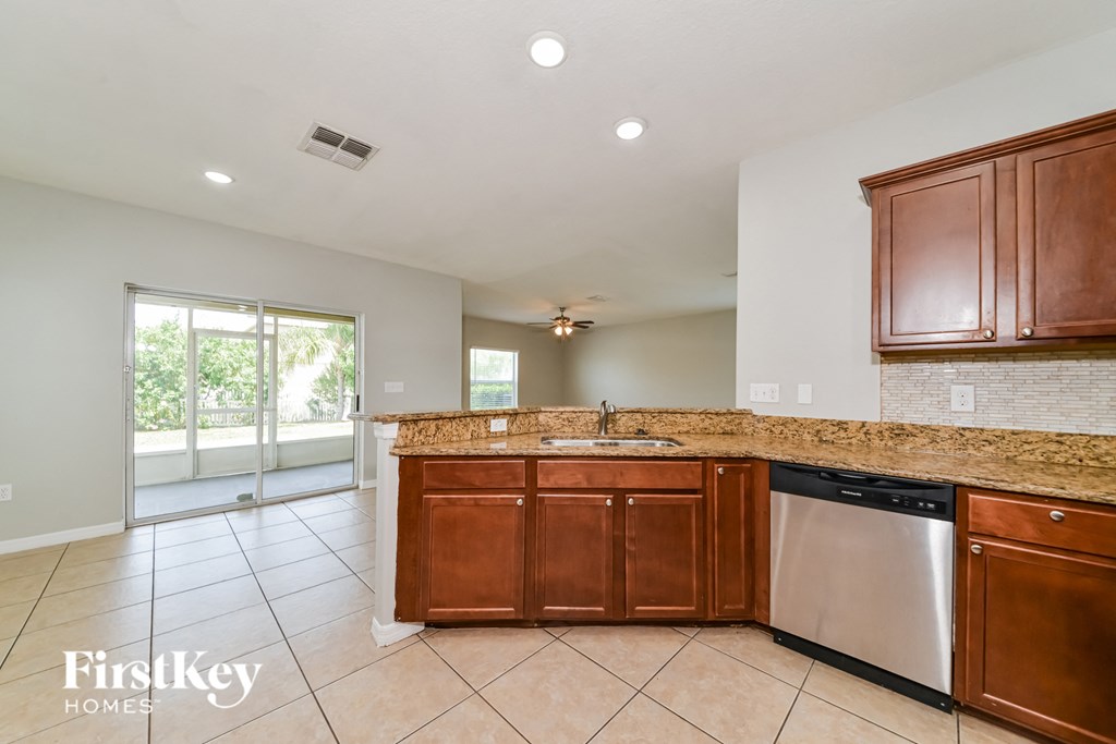 updated kitchen with granite counter tops and stainless steel appliances and wooden cabinets