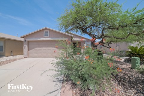 a home with a driveway and a garage door