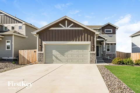 A house with a garage is for sale by FirstKey Homes.