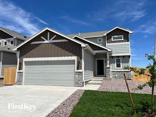 A house with a garage is for sale by FirstKey Homes.