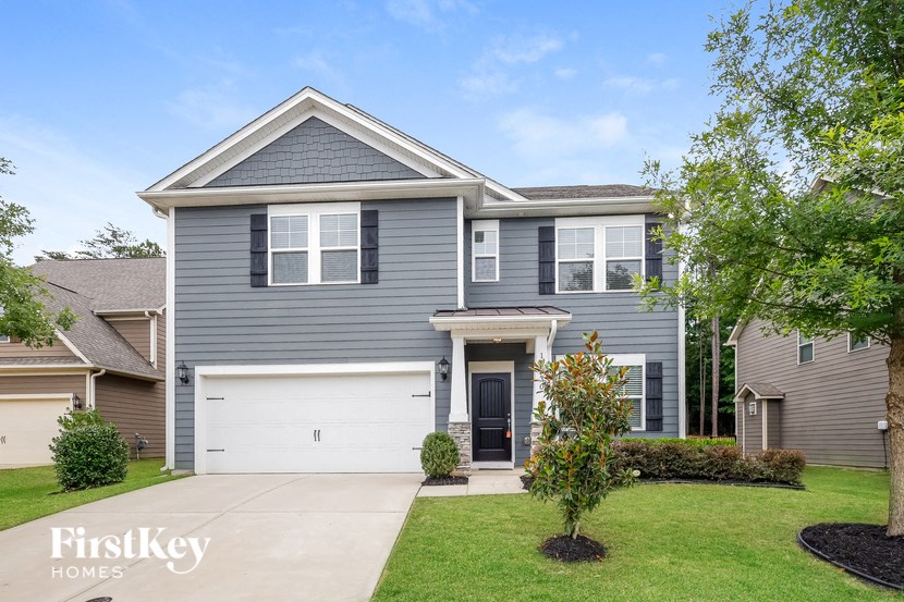 a blue house with a white garage door