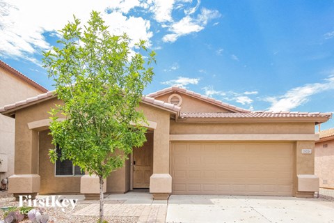 a house with a tree in front of it
