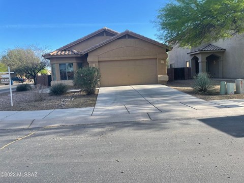 a house with a driveway in front of it