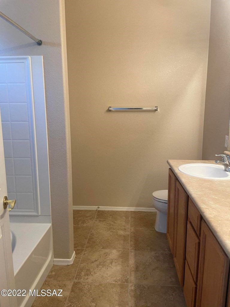 a bathroom with a sink toilet and bath tub