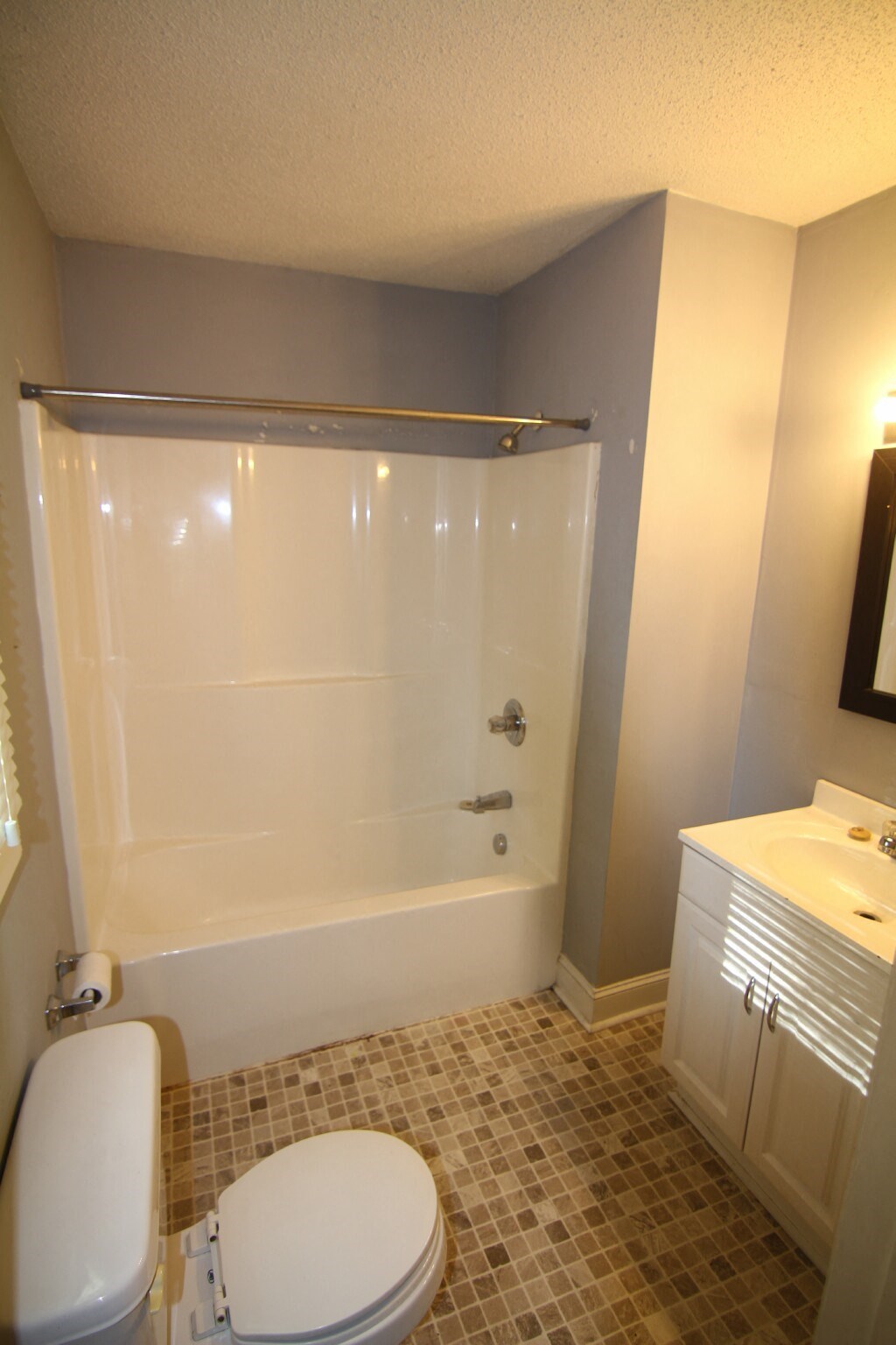 a small bathroom with a toilet and a shower