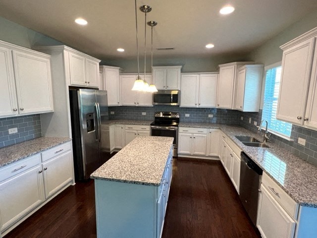 a large kitchen with white cabinets