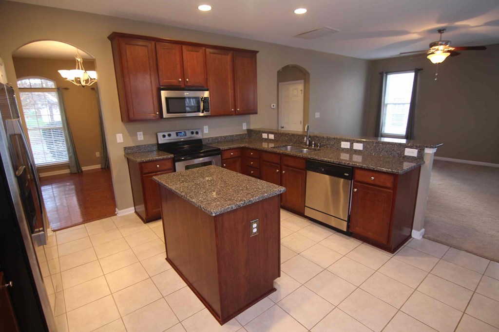 a kitchen with a counter top and a sink