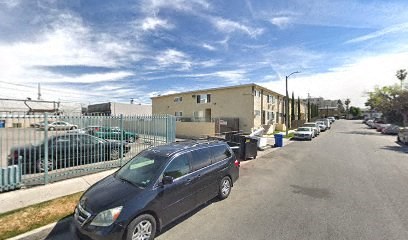 a row of cars parked on the side of a street