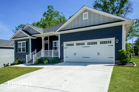 a blue house with a white garage door