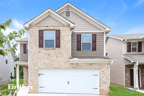 a house with a white garage door in front of it