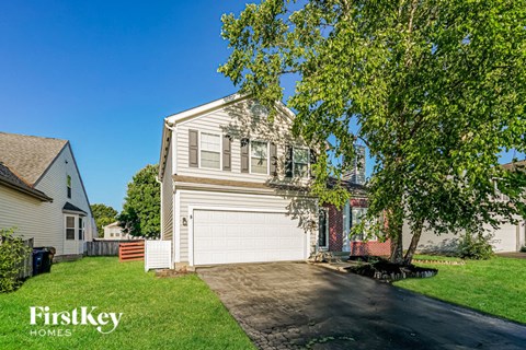 a white house with a white garage door