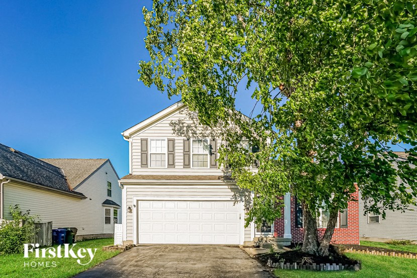 a white garage door in front of a house