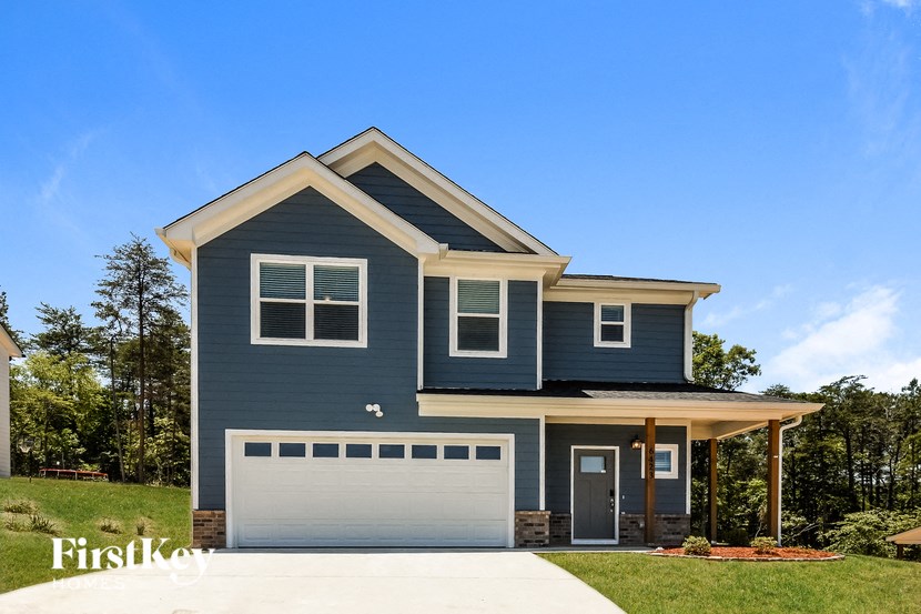a blue house with a white garage door