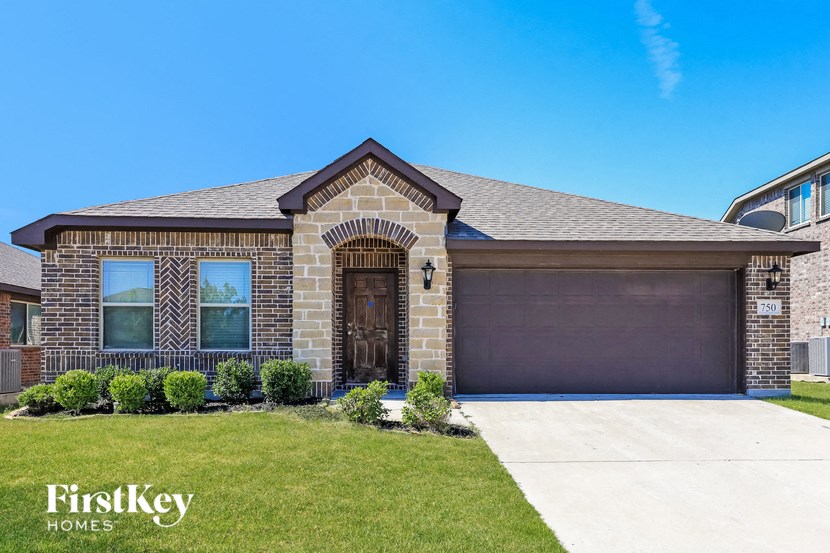 a house with a driveway and a garage door