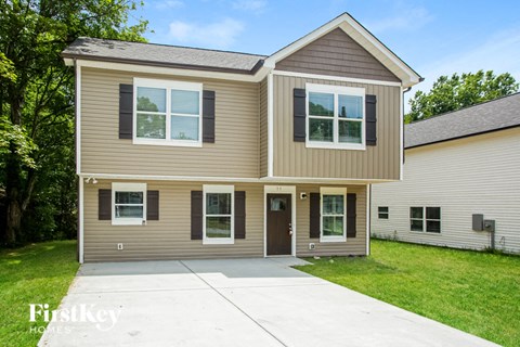 a tan and with a driveway