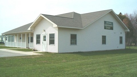 a white building with a sign on the side of it