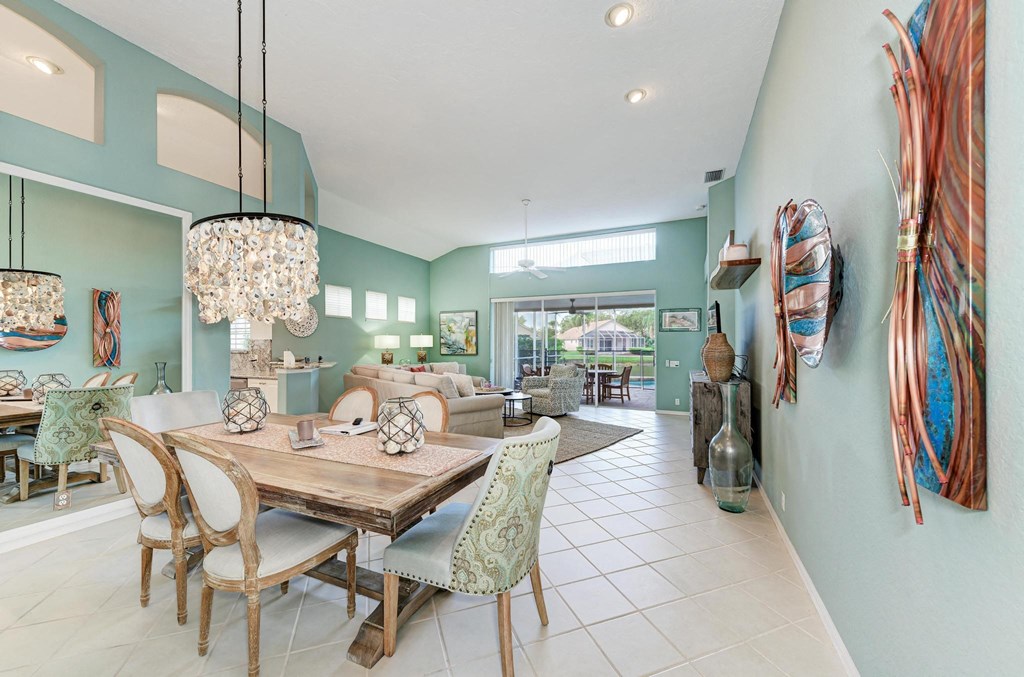 the dining room is open to the living room and kitchen
