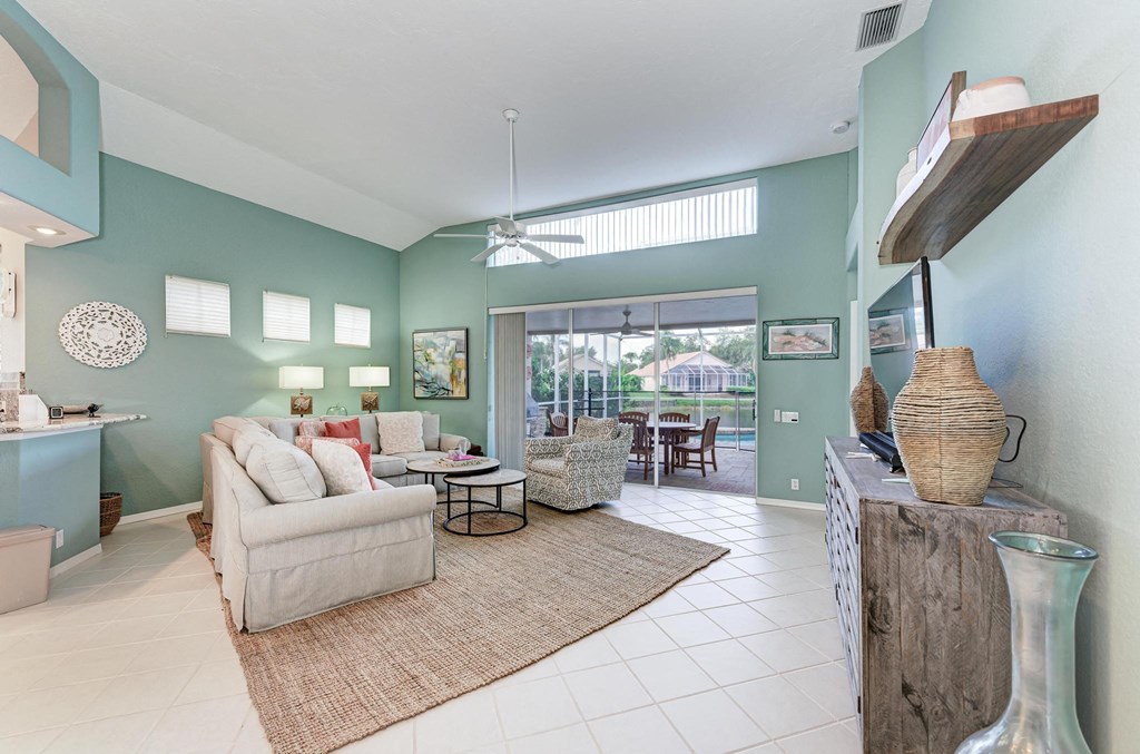 the living room has a large sliding glass door to the patio