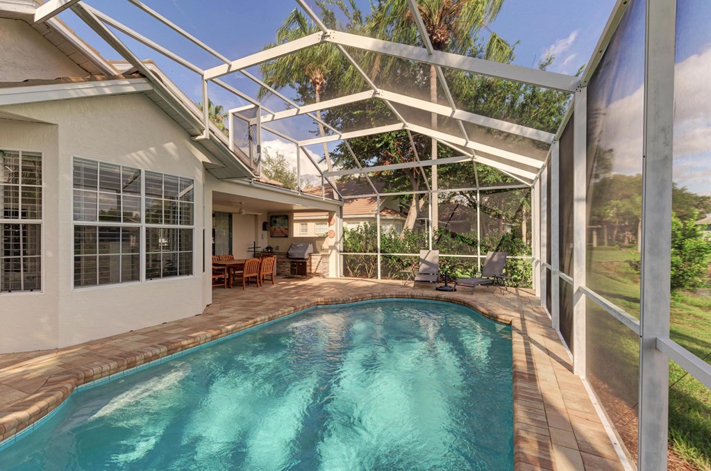 a house with a swimming pool and a glass pool