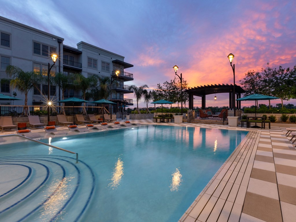 a swimming pool at dusk at the resort at longboat key club