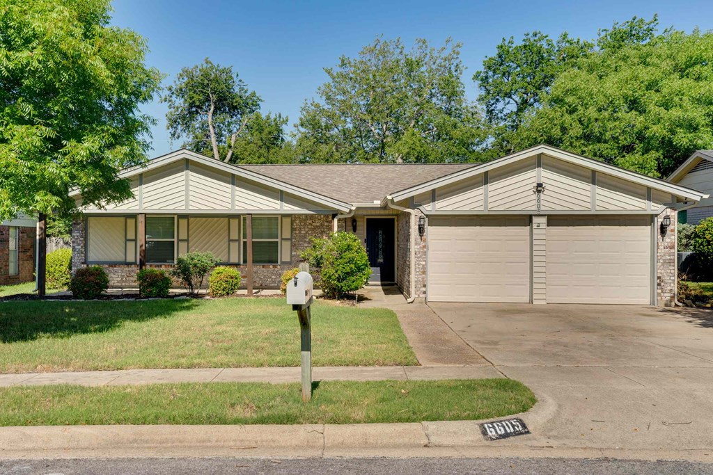 a house with a parking meter in front of it