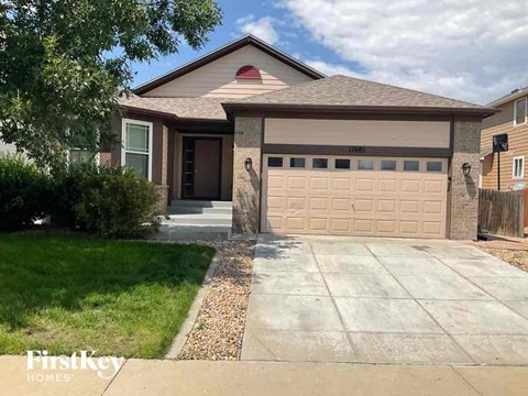 a house with a driveway and a garage door
